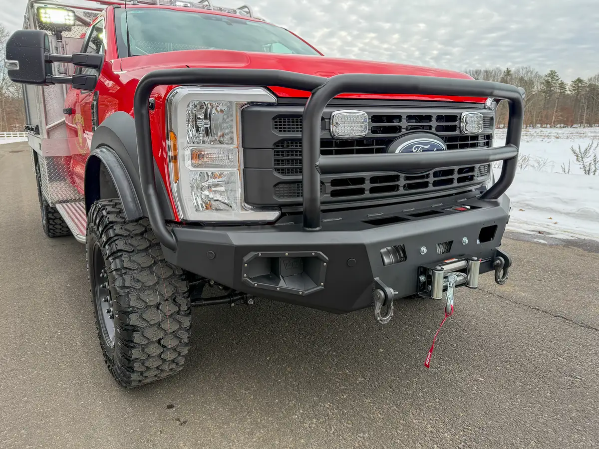 Front bumper and grille close-up with winch fairlead.